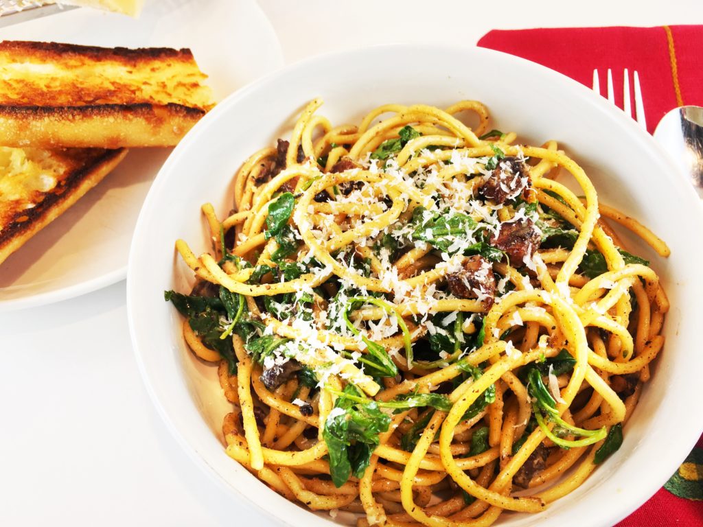 Cacio e Pepe with lemon arugula pancetta