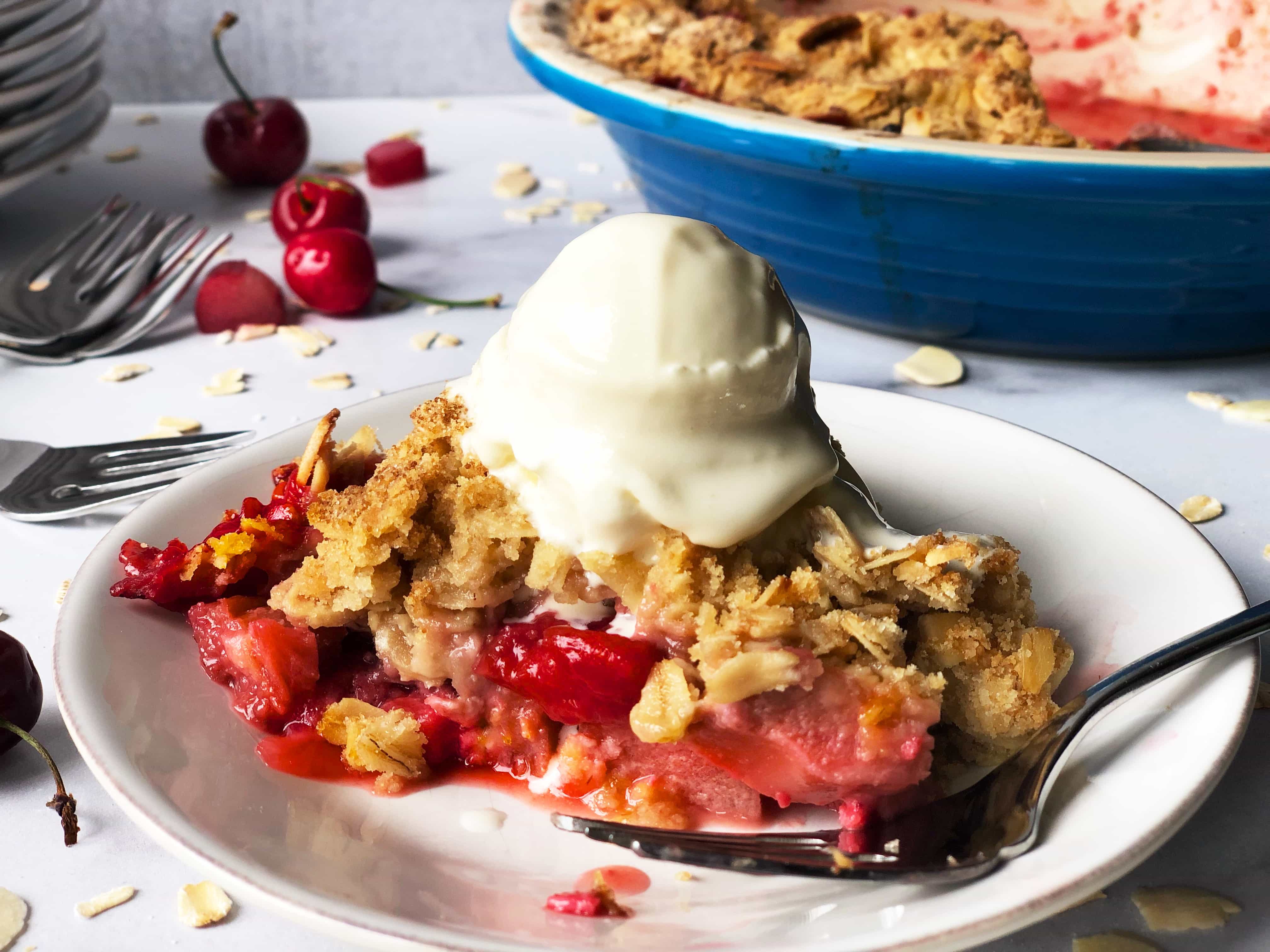 Rhubarb Cherry Strawberry Crisp with Melting Ice Cream Close-up