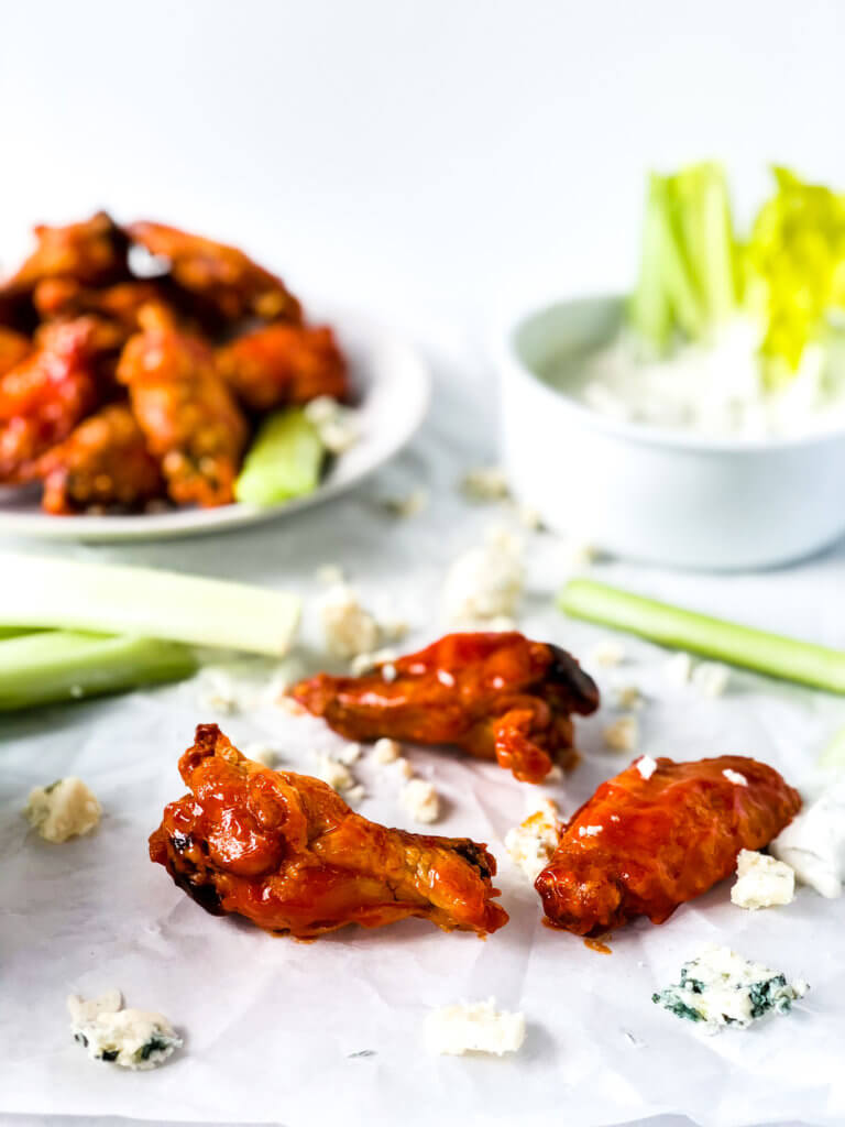 Crispy oven fried chicken wings with buffalo sauce