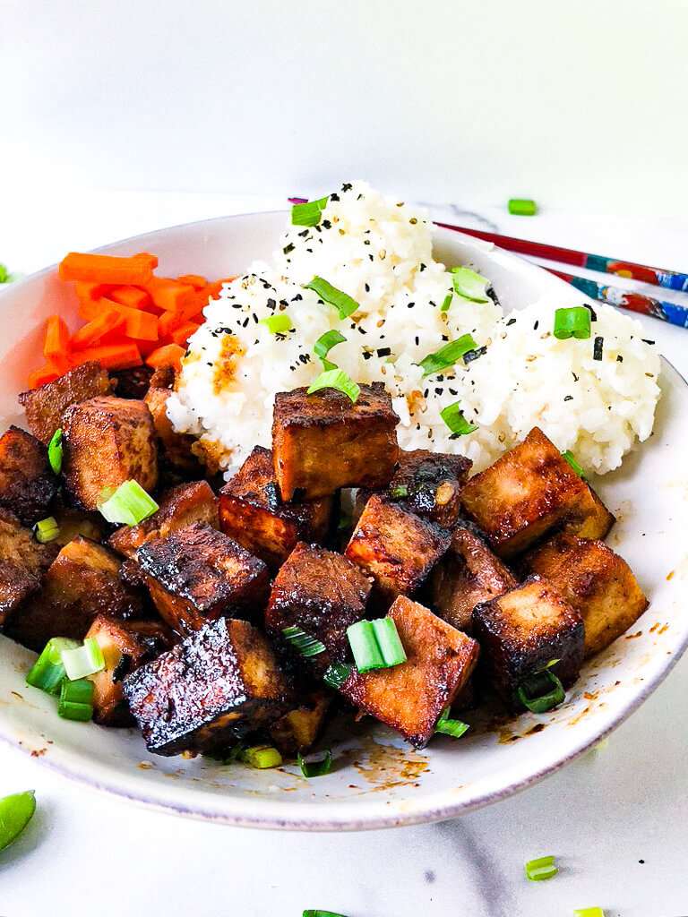 shows crispy marinated tofu with sticky rice