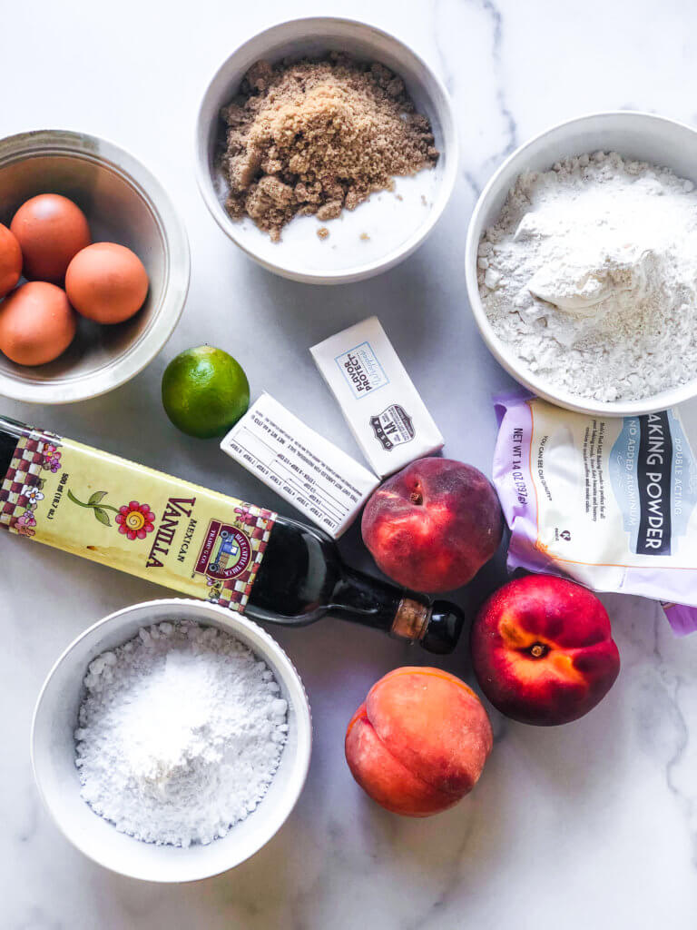 shows ingredients for the peach cake: 4 eggs, brown and white sugar, flour, baking powder, peaches, confectioners sugar, vanilla, lime, and butter