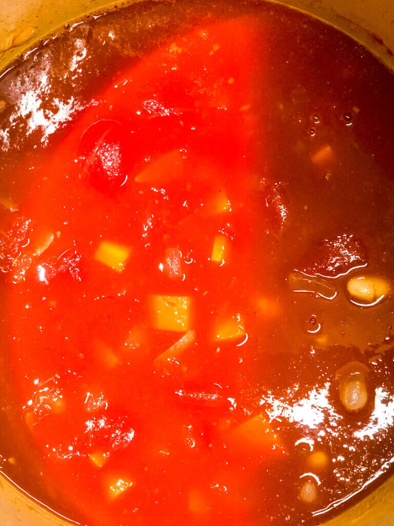 Process shot - overhead - Shows all ingredients in soup simmering. 