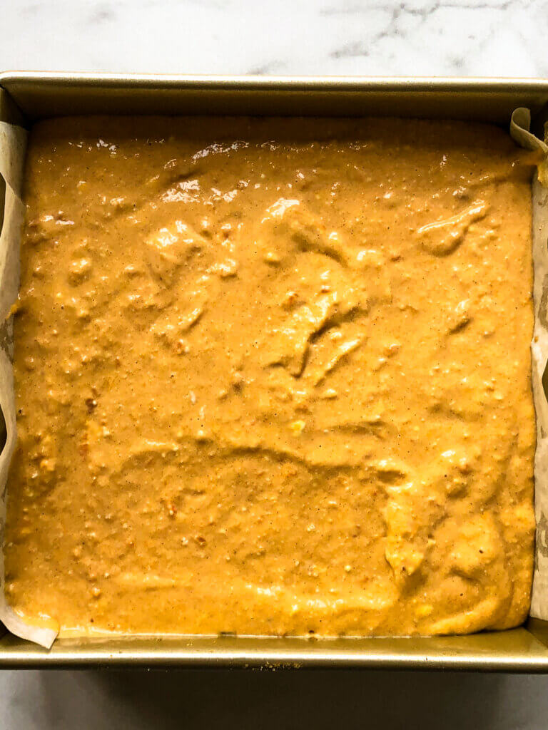 Process shot showing crust filled with cheesecake filling
