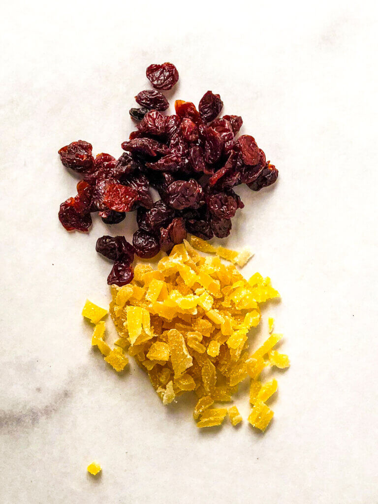 process shot - Overhead shot showing finely chopped crystallized ginger bits and dried cherries