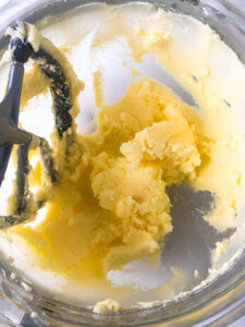 Process shot showing still relatively stiff butter + sugar mixture