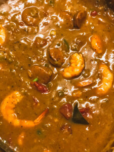 Thickened with file and roux, shrimp are cooked and gumbo ready to serve