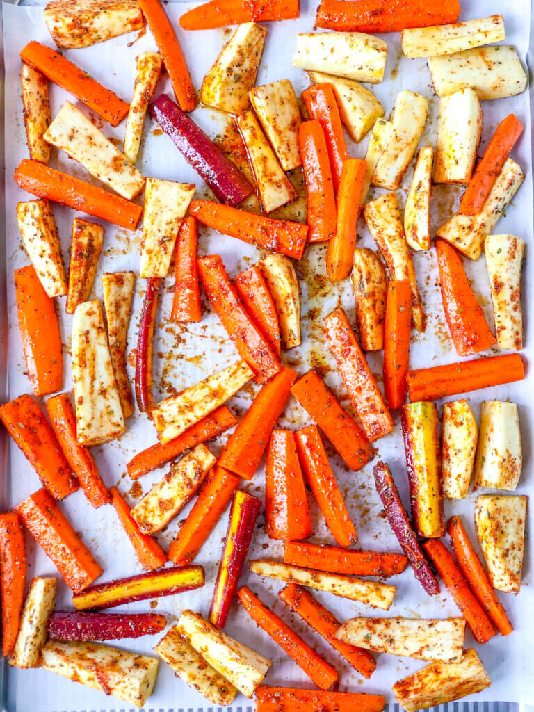 Carrot and parsnip wedges covering most of sheet pan 