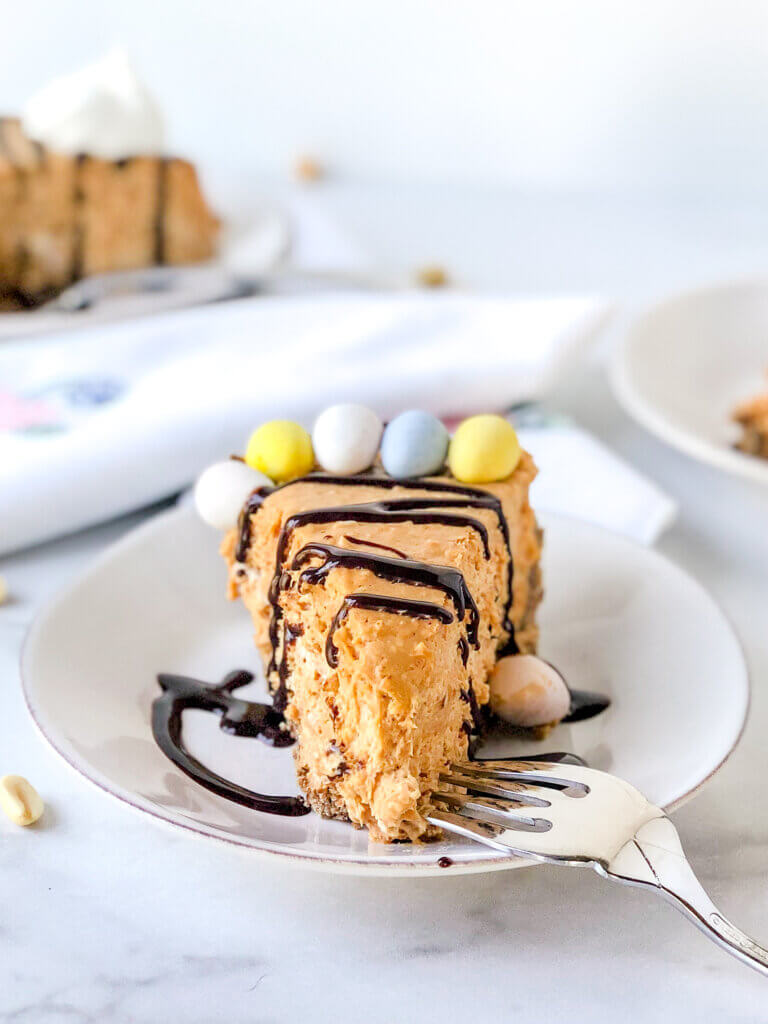 Salted peanut butter caramel cheesecake, a no-bake pie with 2-ingredient chocolate cookie crust, simple peanut butter caramel filling, and candy on top!