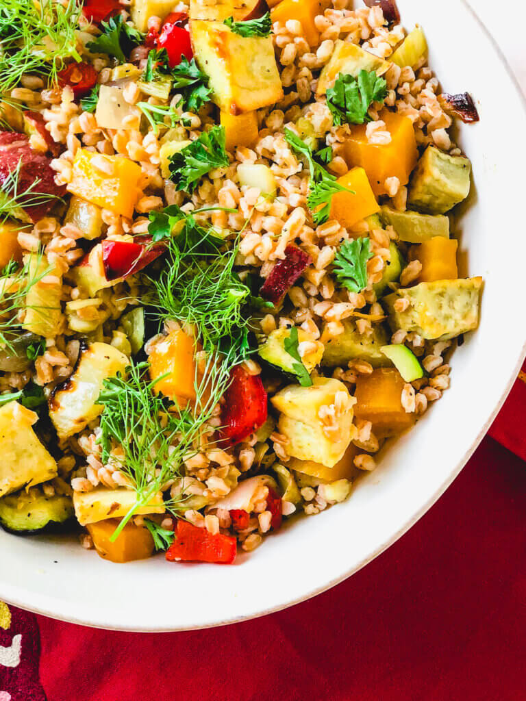 Roasted Vegetables and Farro make a beautiful, tasty salad. A simple orange and rice vinegar dressing adds so much bright flavor to this healthy salad!