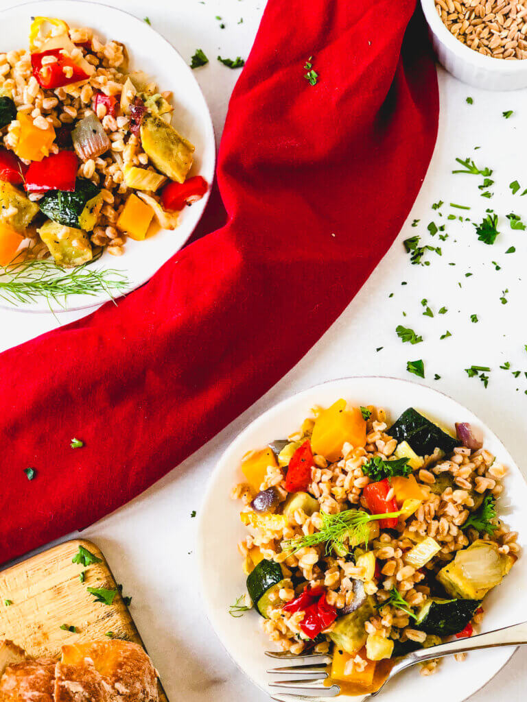 Roasted Vegetables and Farro make a beautiful, tasty salad. A simple orange and rice vinegar dressing adds so much bright flavor to this healthy salad!