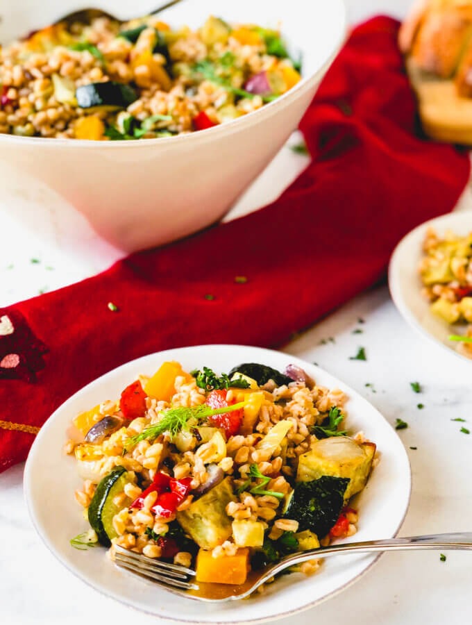 Roasted Vegetables and Farro make a beautiful, tasty salad. A simple orange and rice vinegar dressing adds so much bright flavor to this healthy salad!