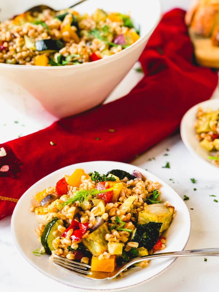 Roasted Vegetables and Farro make a beautiful, tasty salad. A simple orange and rice vinegar dressing adds so much bright flavor to this healthy salad!