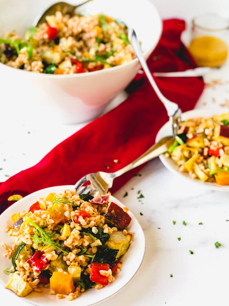 Roasted Vegetables and Farro make a beautiful, tasty salad. A simple orange and rice vinegar dressing adds so much bright flavor to this healthy salad!