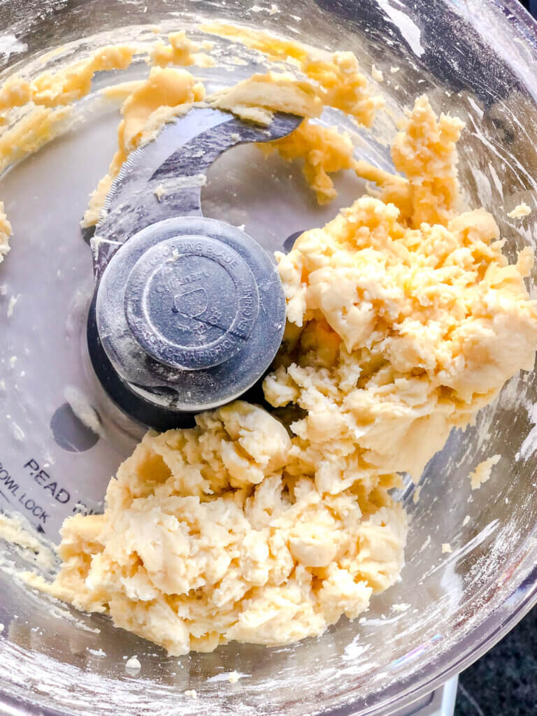 Add water slowly to form soft dough