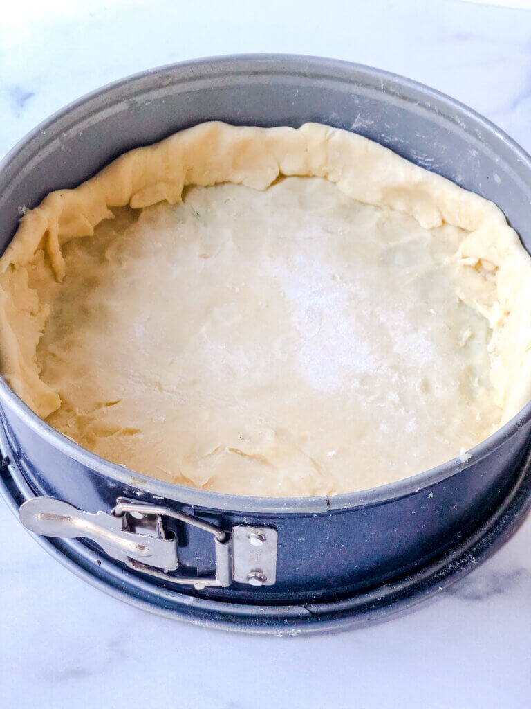 Place the crust in the pan, and fold the edge inward