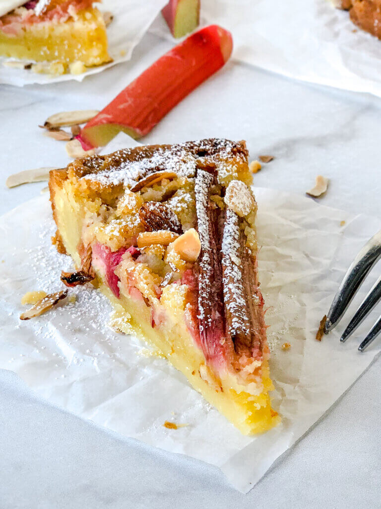 Rhubarb Bakewell tart with its dense, sweet, orange-accented almond frangipane filling and slices of rhubarb is indescribably delicious!