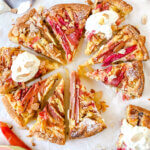 Rhubarb Frangipane Tart is an almond-filled tart, topped with rhubarb and sliced almonds. Indescribably delicious!