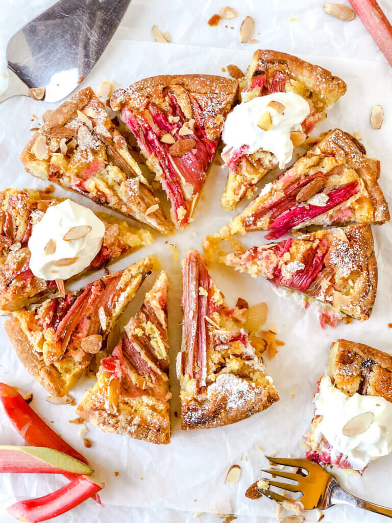 Rhubarb Frangipane Tart is an almond-filled tart, topped with rhubarb and sliced almonds. Indescribably delicious!